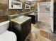 Spa-like bathroom with double vanity, glass sinks and slate tile flooring at 1711 Shadow View Cir # 1711, Maitland, FL 32751