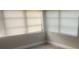 Bright living room with new flooring and window blinds at 401 Martin Luther King Jr Ave, Wildwood, FL 34785