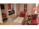 Open concept living area with Mickey Mouse decor and dining space at 3100 Parkway Blvd # 748, Kissimmee, FL 34747