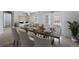 Elegant dining room with wooden table and access to the backyard at 356 Nova Dr, Davenport, FL 33837