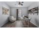 Bright home office features built-in shelving and hardwood floors at 356 Nova Dr, Davenport, FL 33837