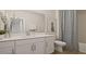 Bathroom with white vanity and gray shower curtain at 12614 Clear Sapphire Dr # 137, Winter Garden, FL 34787