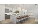 Modern kitchen with gray cabinets, a large island, and stylish pendant lights at 12614 Clear Sapphire Dr # 137, Winter Garden, FL 34787