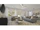 Living room with gray couches and access to patio at 12614 Clear Sapphire Dr # 137, Winter Garden, FL 34787