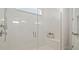 Spa-like shower with glass enclosure, built-in seat, and rainfall shower head at 12614 Clear Sapphire Dr # 137, Winter Garden, FL 34787