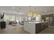 Open kitchen with large island and modern appliances at 12614 Clear Sapphire Dr # 137, Winter Garden, FL 34787