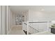 Upstairs hallway with wall art and carpet at 12614 Clear Sapphire Dr # 137, Winter Garden, FL 34787