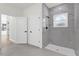 Bathroom with a large walk-in shower and marble tile at 494 Marion Oaks Trl, Ocala, FL 34473