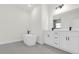 Modern bathroom with double vanity, soaking tub, and separate shower at 494 Marion Oaks Trl, Ocala, FL 34473