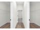Long hallway with two large closets and access to bathroom at 494 Marion Oaks Trl, Ocala, FL 34473