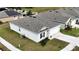 Aerial view of a single-story house in a quiet residential community at 564 Boardwalk Ave, Haines City, FL 33844