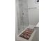 Walk-in shower with glass enclosure and marble tile at 6748 Cherry Rd, Ocala, FL 34472