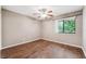 Bright bedroom with wood-look flooring and a ceiling fan at 358 Winchester Ct, Longwood, FL 32779