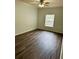 Bright bedroom with ceiling fan and wood-look flooring at 185 Villa Di Este Ter # 201, Lake Mary, FL 32746