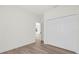 Bright bedroom with wood-look floors and double closets at 494 Marion Oaks Trl, Ocala, FL 34473