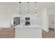 Modern kitchen boasts white cabinets, large island, and stainless steel appliances at 494 Marion Oaks Trl, Ocala, FL 34473