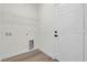 Laundry room with shelving, vinyl flooring and a door at 494 Marion Oaks Trl, Ocala, FL 34473