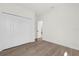 Well-lit bedroom with wood-look floors and double doors at 494 Marion Oaks Trl, Ocala, FL 34473