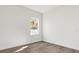Spacious bedroom featuring large windows and wood-look floors at 494 Marion Oaks Trl, Ocala, FL 34473