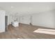 Open living room with wood-look floors and lots of natural light at 494 Marion Oaks Trl, Ocala, FL 34473