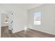Second bedroom with a window and wood-look floors at 494 Marion Oaks Trl, Ocala, FL 34473