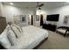 Large bedroom with king bed, TV, and sitting area at 331 Muirfield Loop, Reunion, FL 34747