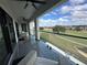 Covered balcony overlooking golf course and community at 331 Muirfield Loop, Reunion, FL 34747