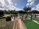 Fun mini golf course with water features and lush landscaping at 331 Muirfield Loop, Reunion, FL 34747