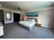 Serene bedroom with king-size bed and large windows at 331 Muirfield Loop, Reunion, FL 34747