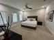 Spacious bedroom with a king-size bed and neutral color palette at 331 Muirfield Loop, Reunion, FL 34747