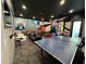 Game room featuring arcade games, ping pong, and a seating area at 331 Muirfield Loop, Reunion, FL 34747