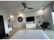 Spacious bedroom with king bed, TV, and seating area at 331 Muirfield Loop, Reunion, FL 34747