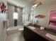 Clean bathroom with shower, tub, and double vanity at 331 Muirfield Loop, Reunion, FL 34747