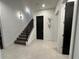 Modern staircase with metal railing and stylish wall decor at 331 Muirfield Loop, Reunion, FL 34747