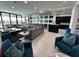 Open living space showcasing comfortable seating and a large window at 331 Muirfield Loop, Reunion, FL 34747