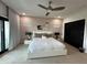Main bedroom with king bed, ceiling fan, and modern decor at 331 Muirfield Loop, Reunion, FL 34747