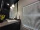 Upscale bathroom with granite countertop, modern sink, and window blinds at 331 Muirfield Loop, Reunion, FL 34747