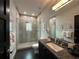 Bathroom with shower, single vanity, and modern finishes at 331 Muirfield Loop, Reunion, FL 34747