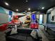 Fun game room with arcade games, ping pong, and seating at 331 Muirfield Loop, Reunion, FL 34747