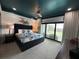 Spacious main bedroom with plush bed, large windows, and water view at 331 Muirfield Loop, Reunion, FL 34747