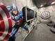 Game room with Marvel-themed murals and multiple gaming stations at 331 Muirfield Loop, Reunion, FL 34747