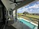 Covered patio overlooking the pool and golf course at 331 Muirfield Loop, Reunion, FL 34747