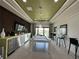 Game room with pool table, wet bar, and large TV at 331 Muirfield Loop, Reunion, FL 34747