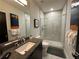 Modern bathroom with walk-in shower and single vanity at 331 Muirfield Loop, Reunion, FL 34747