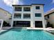 Luxury pool and patio area with a view at 331 Muirfield Loop, Reunion, FL 34747