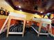 Themed bedroom with bunk beds, city skyline mural and Incredibles decor at 331 Muirfield Loop, Reunion, FL 34747