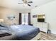 Bright main bedroom with king-size bed, private access to backyard, and ample closet space at 429 Coventry Rd, Davenport, FL 33897