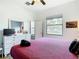 Bedroom with a king-size bed, dresser, and window view at 429 Coventry Rd, Davenport, FL 33897