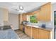 Kitchen with light wood cabinets, granite countertops and stainless steel appliances at 180 N Lakewood Cir, Maitland, FL 32751