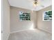 Bright bedroom with neutral walls, carpeting, and ceiling fan at 180 N Lakewood Cir, Maitland, FL 32751